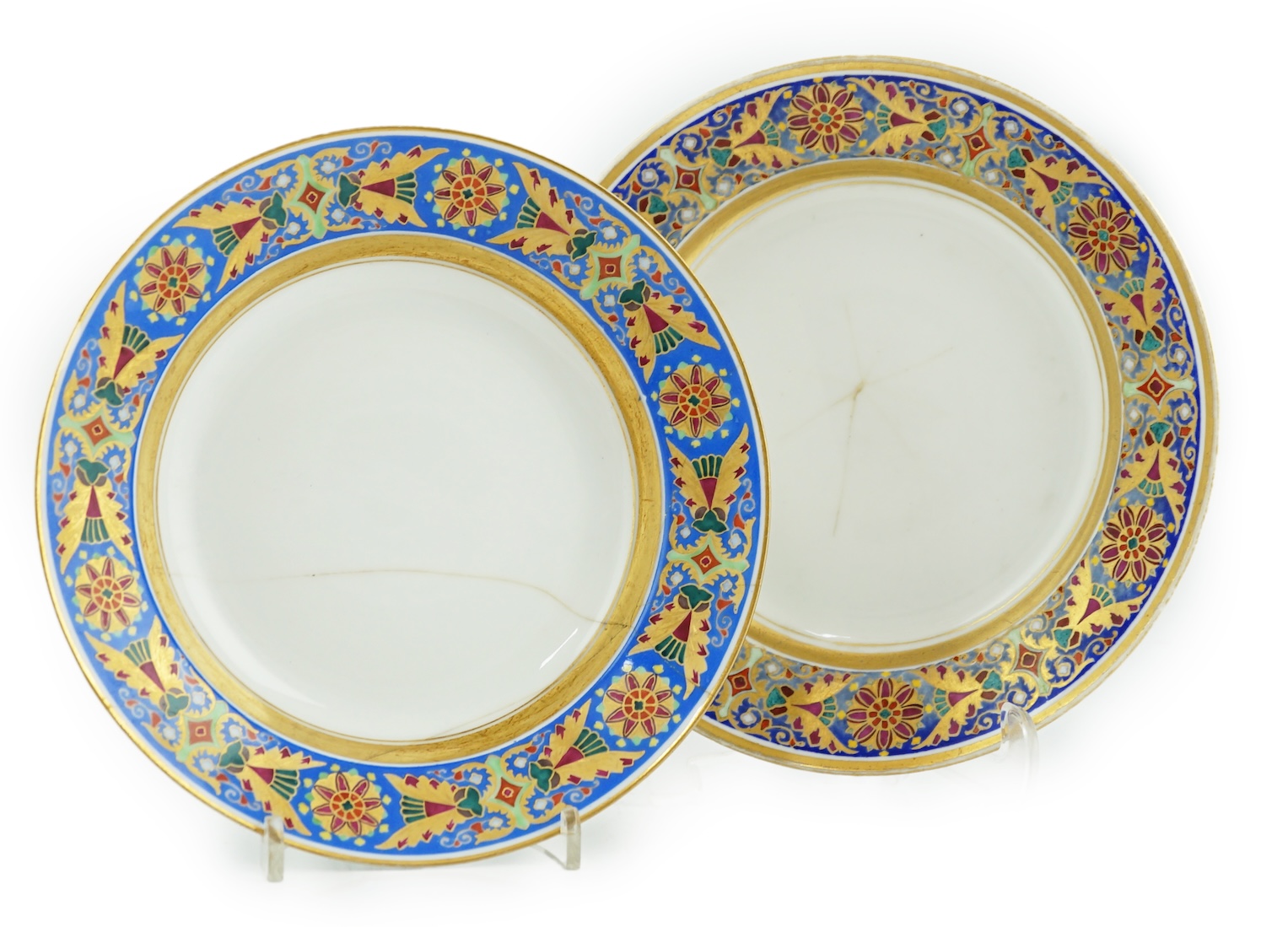 A pair of Nicholas II Imperial porcelain factory plates, from the Gothic service, green printed marks, 23.5cm diameter. Condition - poor to fair repairs